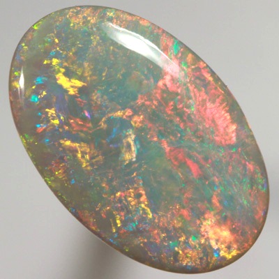 SOLID SEMI BLACK OPAL Top quality. Floral Harlequin pattern, very bright and sparkling red and orange. SEE VIDEO  
